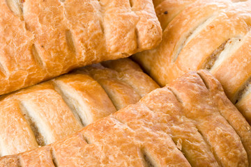 Abstract background from appetizing tasty fresh rolls