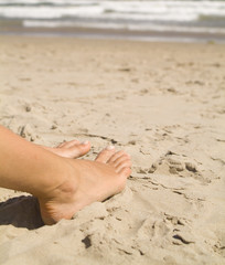 feet on the beach