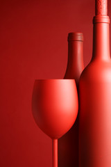 Still-life with red wine bottles and glass