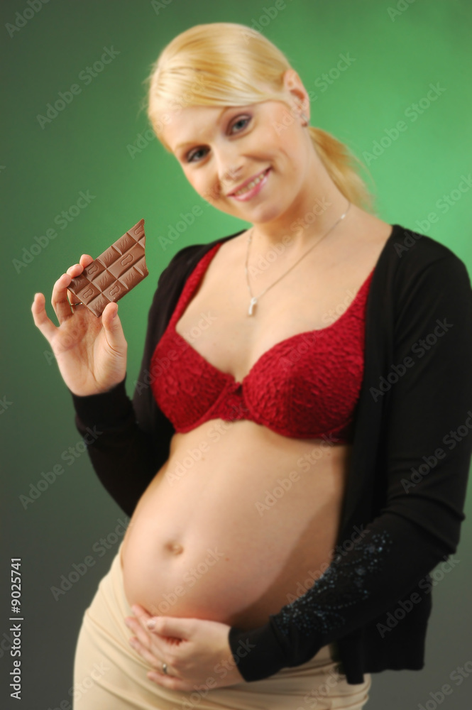 Wall mural a blonde young pretty pregnant woman