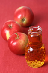 bottle of apple juice and some fresh apples