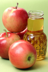 bottle of apple juice and some fresh apples