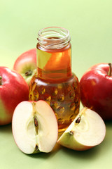 bottle of apple juice and some fresh apples