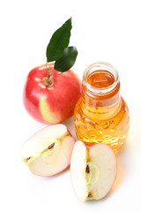 bottle of apple juice and some fresh apples