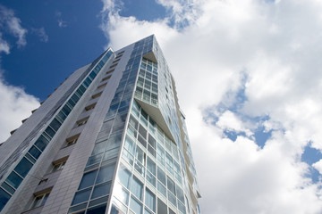 Fototapeta na wymiar Modern urban building. Glass balconies.