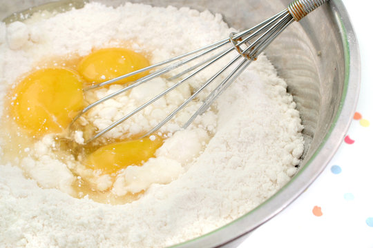 Cake Flour Mix With Three Eggs And Whisk