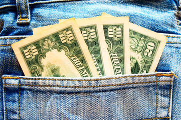 Jeans and dollar banknotes background