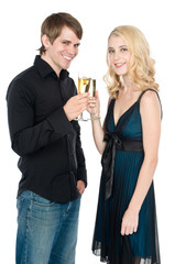 An attractive young couple drinking champagne together