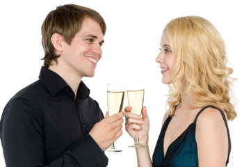 An attractive young couple drinking champagne together