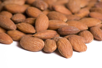Close up of almonds set on a white background