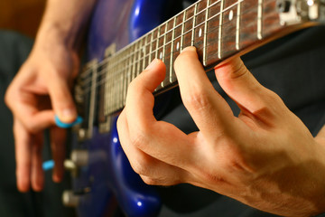 man play solo on blue guitar