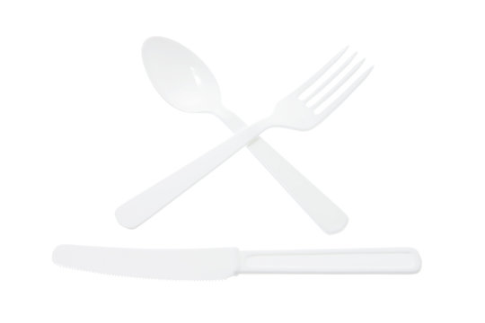 Arrangement of Plastic Cutlery on White Background