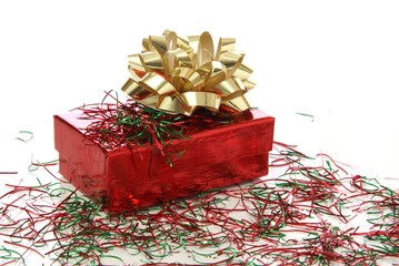 Christmas gift box in red with gold bow