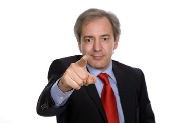 Businessman in a suit pointing, focus on the finger