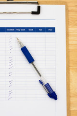 Survey attached to clipboard, excellent customer service