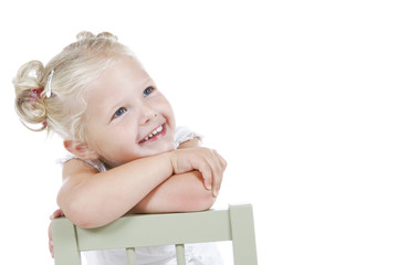 cute little girl dressed in white dreaming away © Melissa Peltenburg