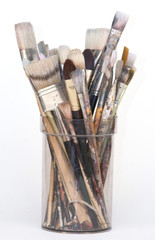 Pot of used artist brushes