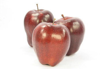 Picture of three red apples over white background.