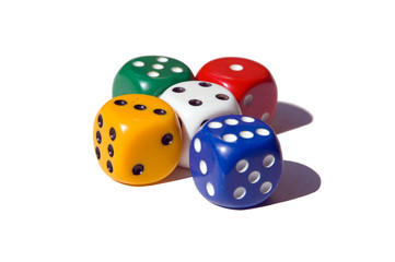 Multi-coloured playing bones on a white background