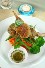 Crumbed lamb cutlets on green beans and sweet potato