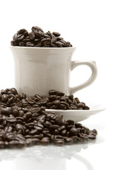 Coffee beans in coffee cup