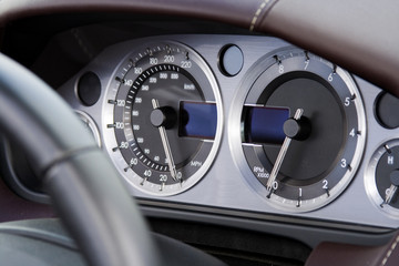 chrome dials on fast expensive modern car