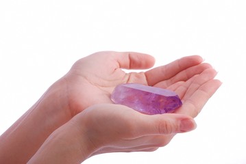 Hands holding amethyst - semipreciou gem