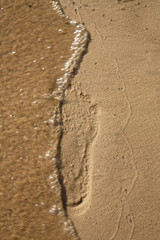 trace on sand, is washed off by water.