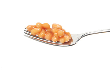 Baked beans on a fork isolated on white