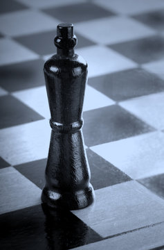 Chess Piece On Checkered Playing Board