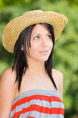 Beautiful young lady with hat over green background