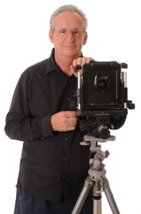 Senior photographer with a large format camera on tripod