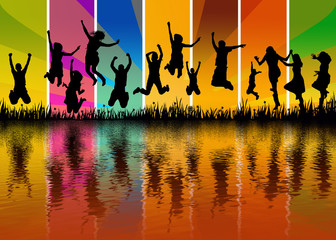 happy people jumping on a meadow