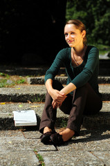 Obraz premium Student Reading in a public park