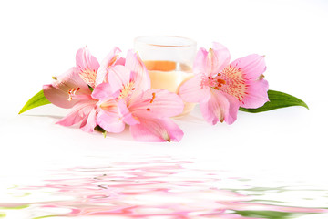 candle and pink flowers