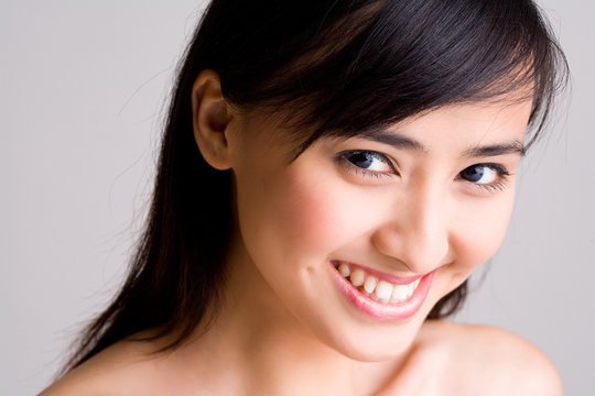 happy smile of asian young woman with beautiful eyes
