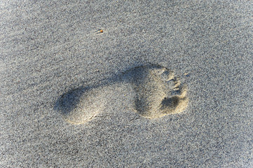 pied dans le sable
