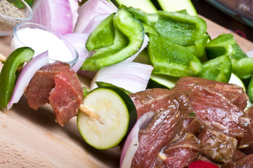 getting ready to make shish kabobs raw meat and vegetables