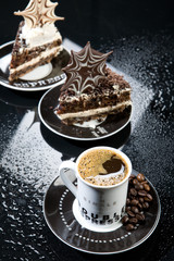 Pieces of chocolate cake and a cup of coffee on a glass