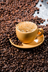 Coffee beans on a black glass