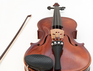Violin and a bow, isolated on a white background.