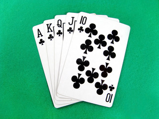 royal flash poker gamble cards on green casino table