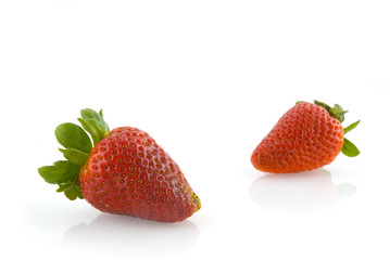 Two isolated juicy strawberries