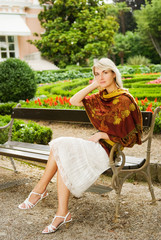 Obraz premium Young beautiful woman relaxing in a park