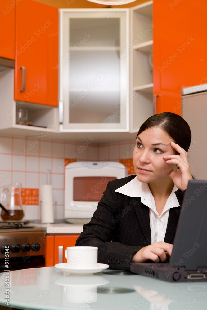 Wall mural attractve brunette woman in kitchen