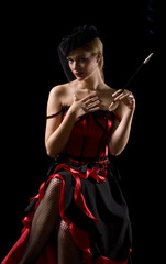 Attractive cabaret girl smoking a sigarette with an extension
