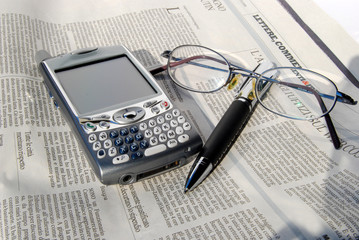 Cell phone, pen and glasses