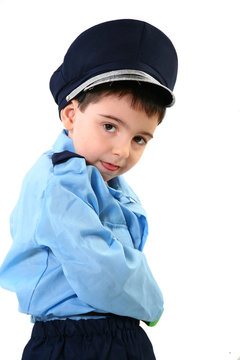 Adorable five year old boy in cop costume.