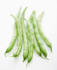 Green beans on white background.