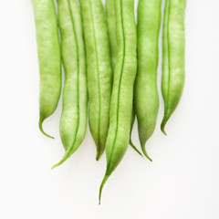 Green beans on white background.